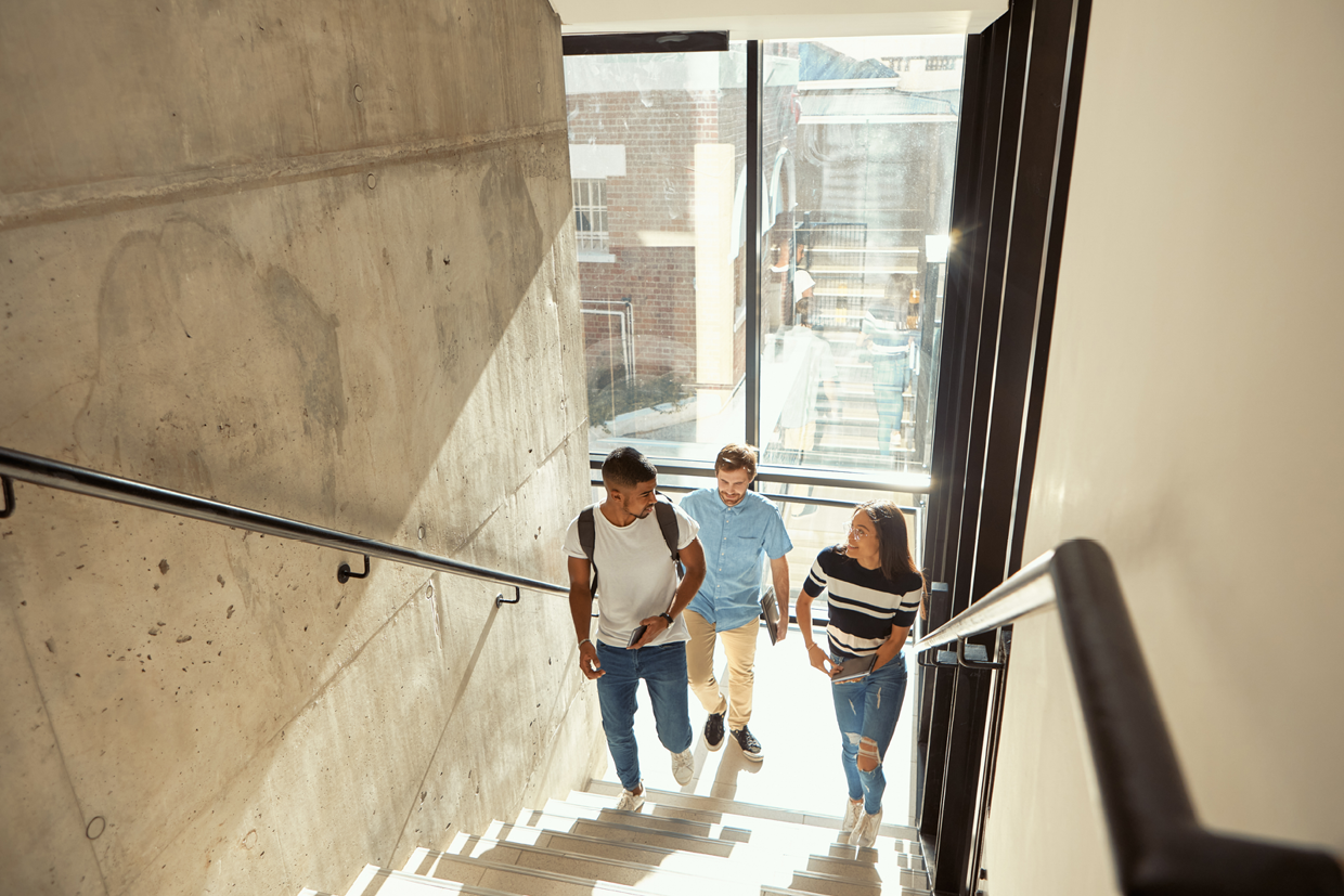 Three people on stairs - 1240x827px
